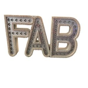 White and silver wood FAB sign